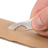 Nite-Ize SkullKey EDC Keychain tool ripping through cardboard